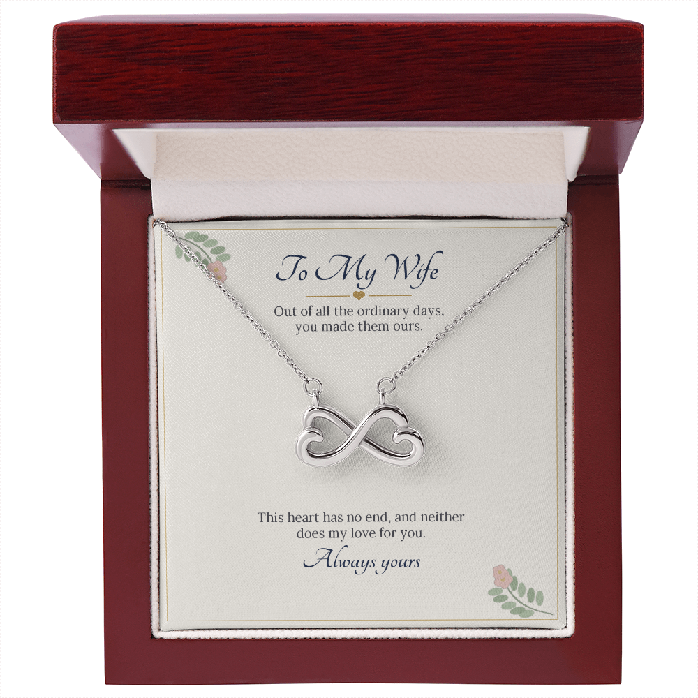 White gold finish infinity heart necklace on the To My Wife card inside an open wooden luxury box