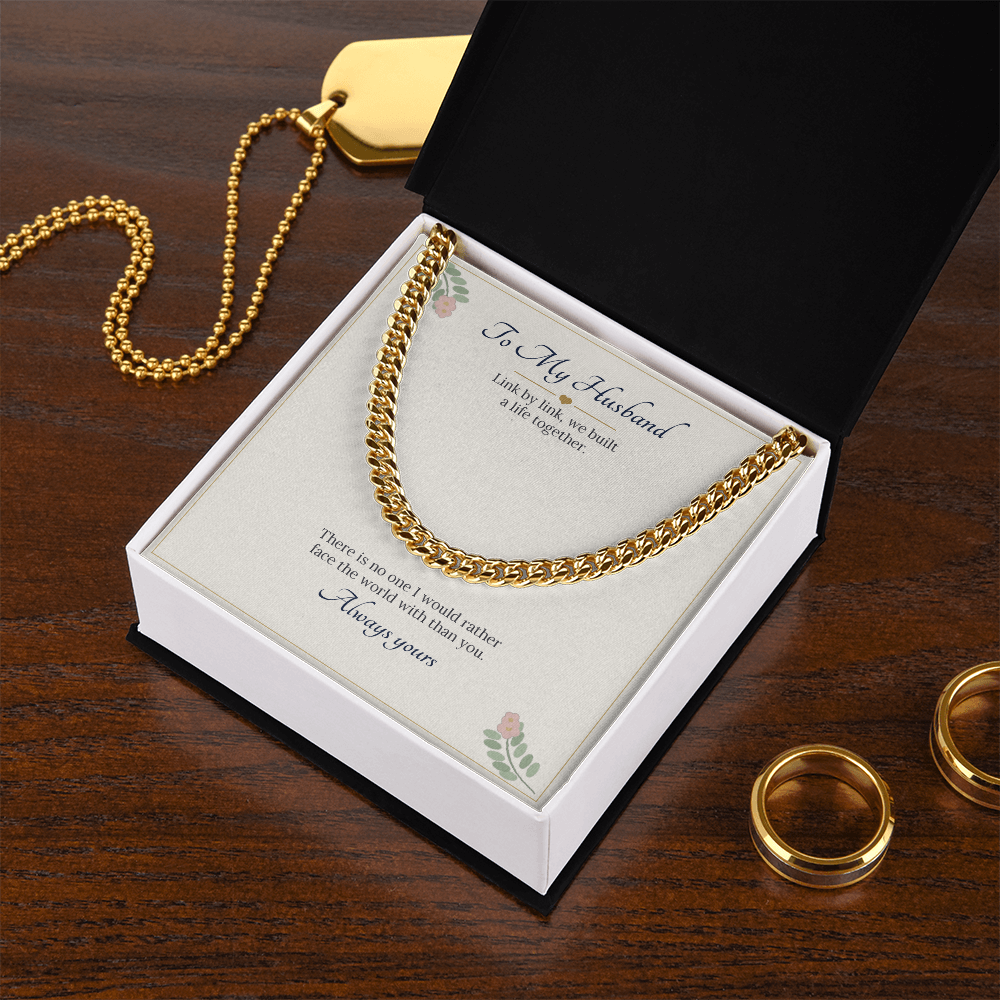 Yellow gold finish Cuban link chain on the To My Husband card in a white gift box on a wooden table