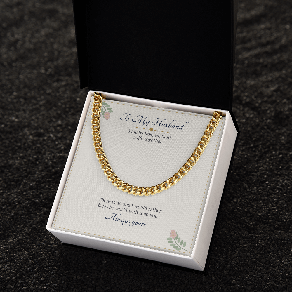 Yellow gold finish Cuban link chain on the To My Husband card in a white gift box on dark stone