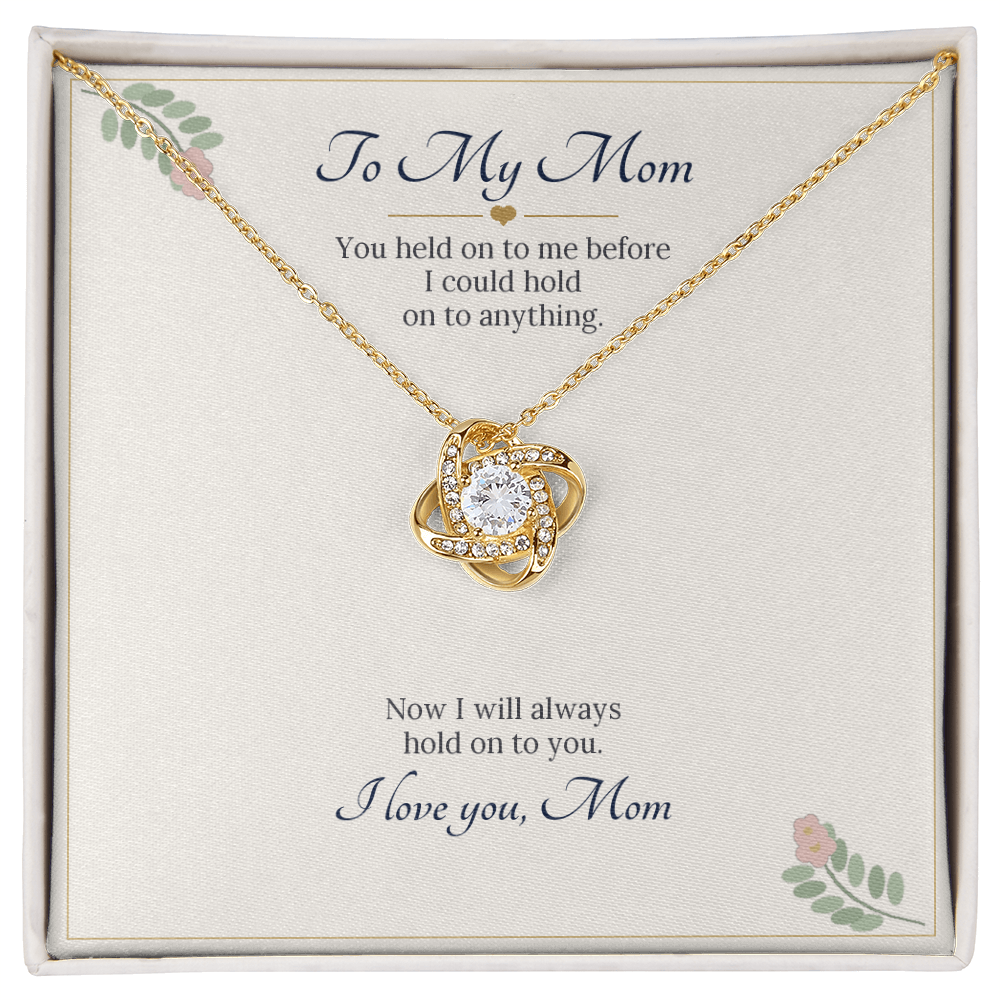 Love knot necklace in yellow gold finish on a cream To My Mom message card