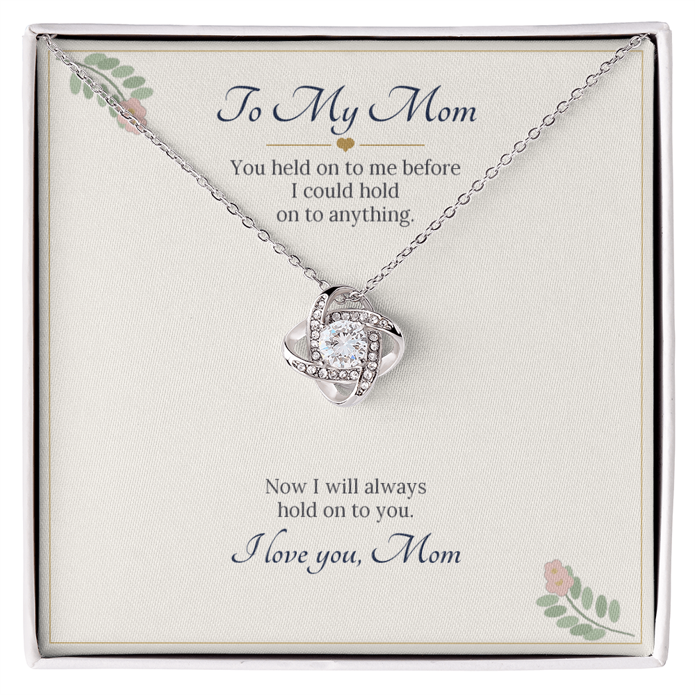Love knot necklace in white gold finish on a cream To My Mom message card