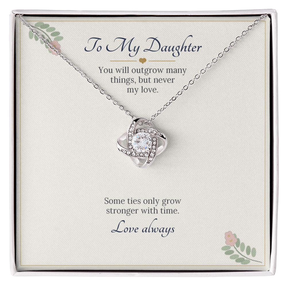 Love knot necklace in white gold finish on a cream To My Daughter message card
