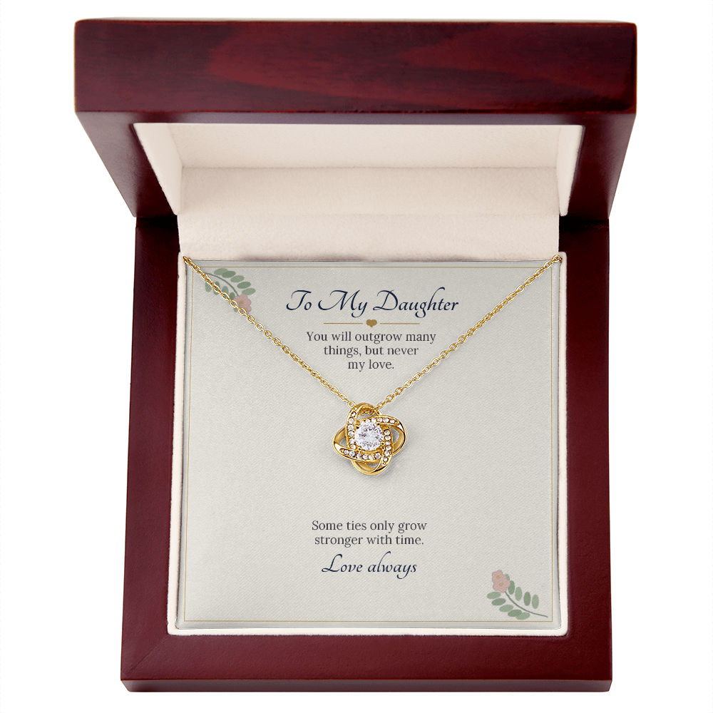 Yellow gold finish love knot necklace on the To My Daughter card inside a wooden luxury box
