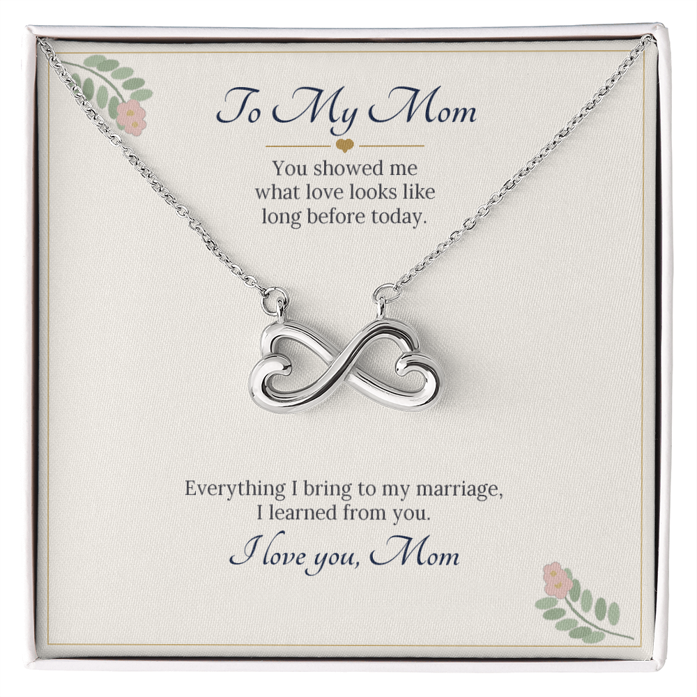 Infinity heart necklace in white gold finish on a cream To My Mom wedding message card, a gift for the mother of the bride