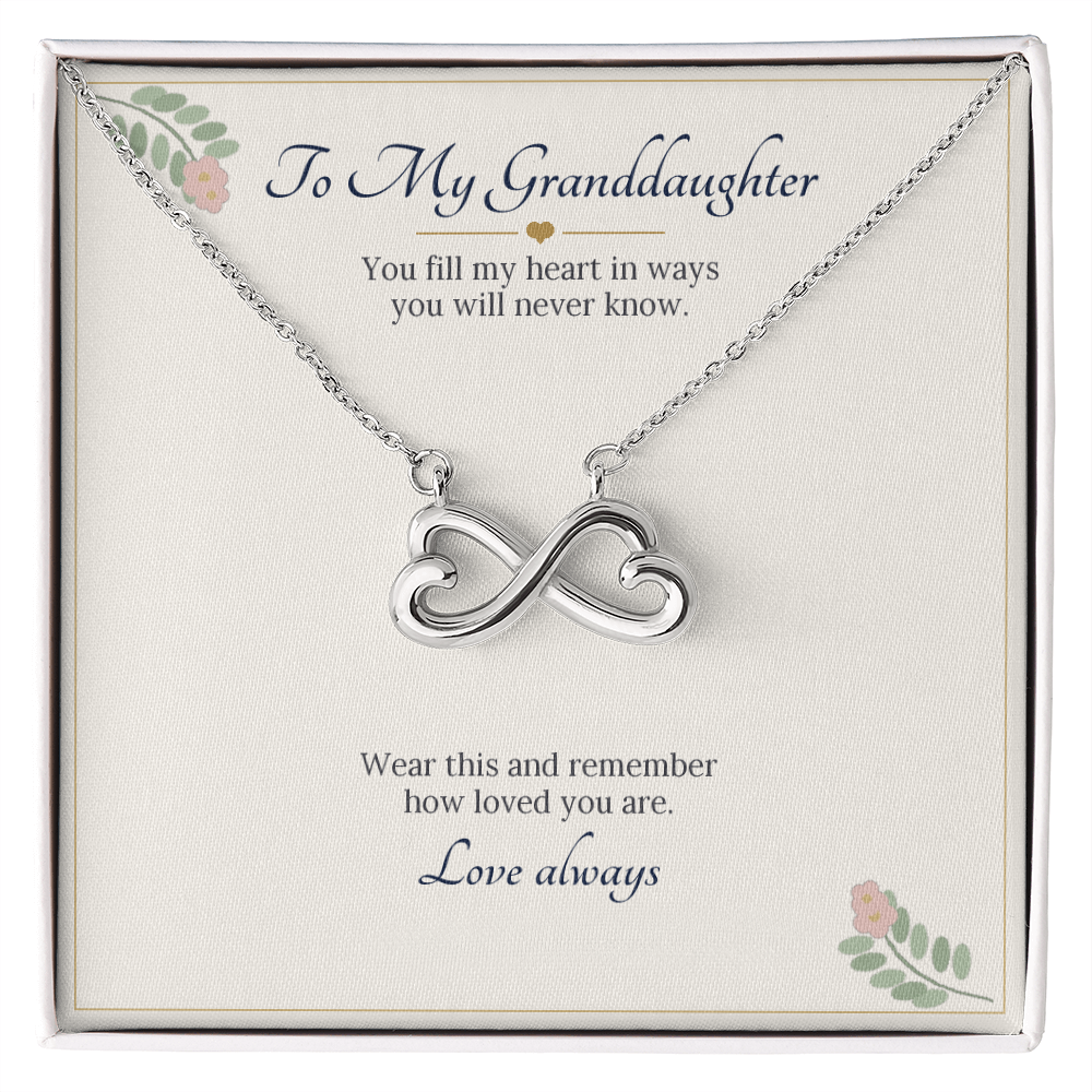 Infinity heart necklace in white gold finish on a cream To My Granddaughter message card