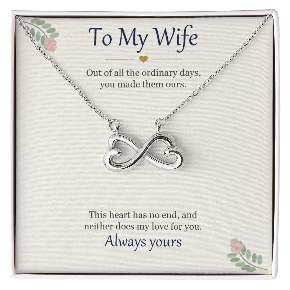 Infinity heart necklace in white gold finish on a cream To My Wife message card