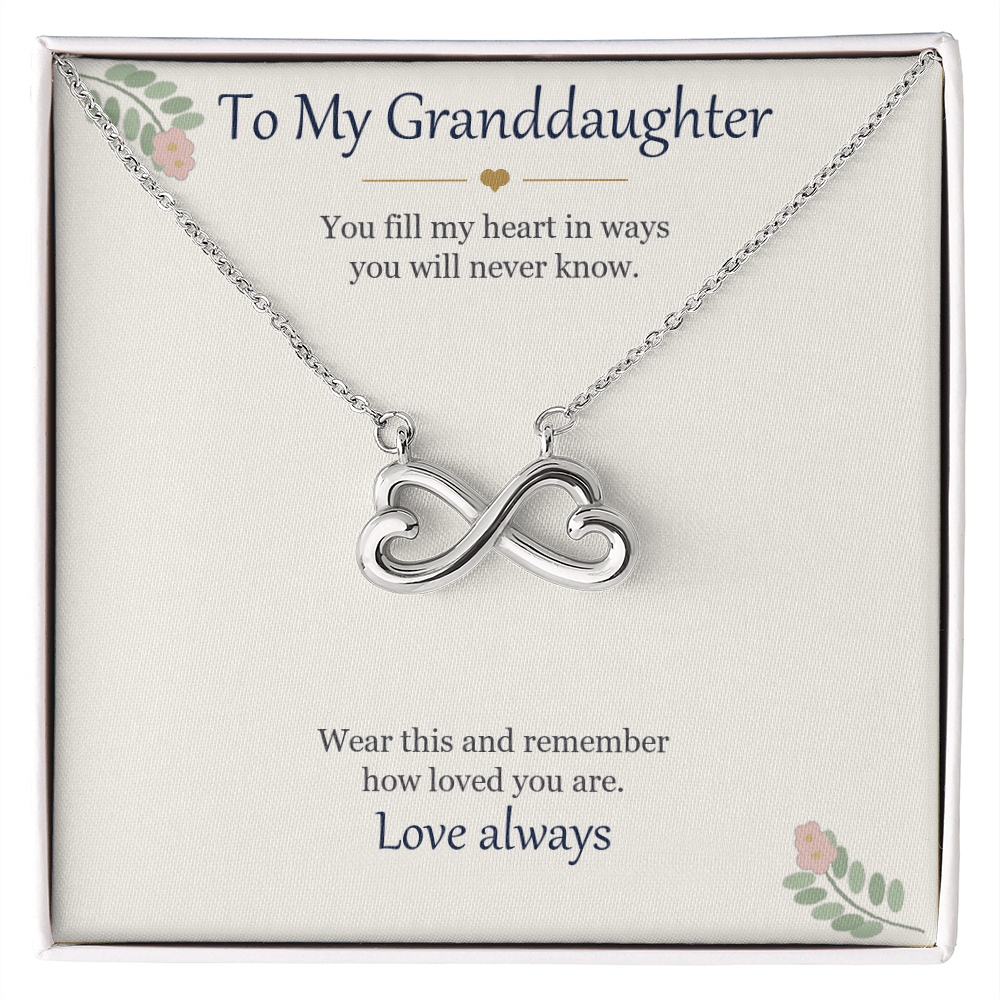 Infinity heart necklace in white gold finish on a cream To My Granddaughter message card
