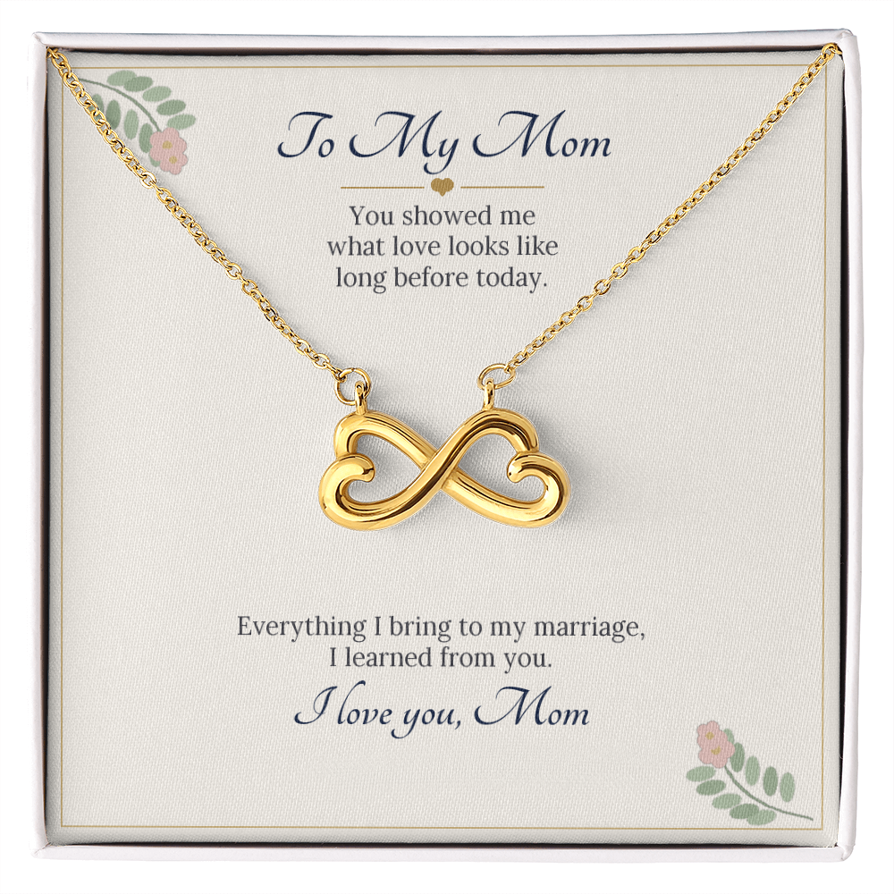 Infinity heart necklace in yellow gold finish on a cream To My Mom wedding message card