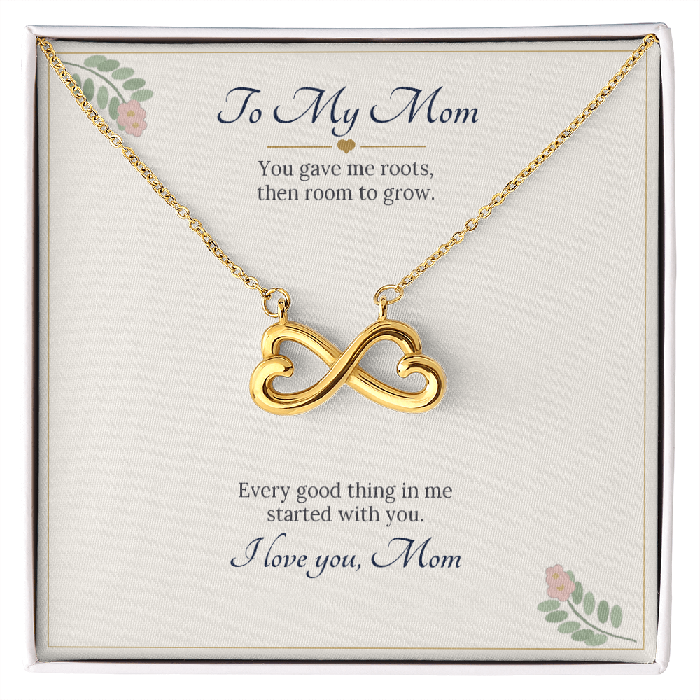 Infinity heart necklace in yellow gold finish on a cream To My Mom message card